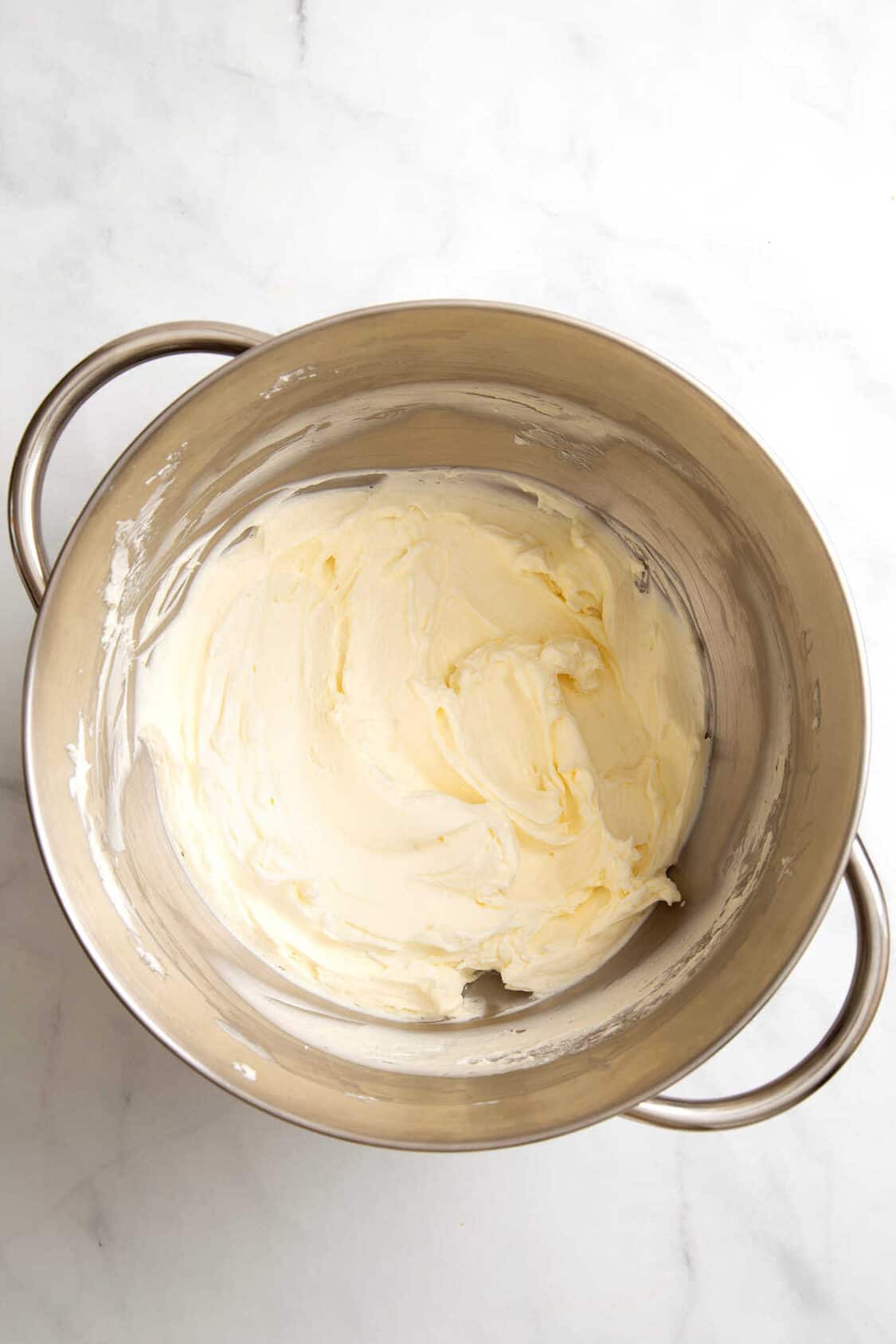 top down image of Philadelphia No Bake Cheesecake filling in a stainless steel mixing bowl. 