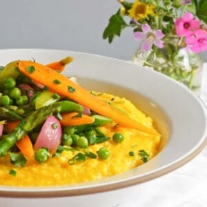spring polenta with fresh vegetables on top