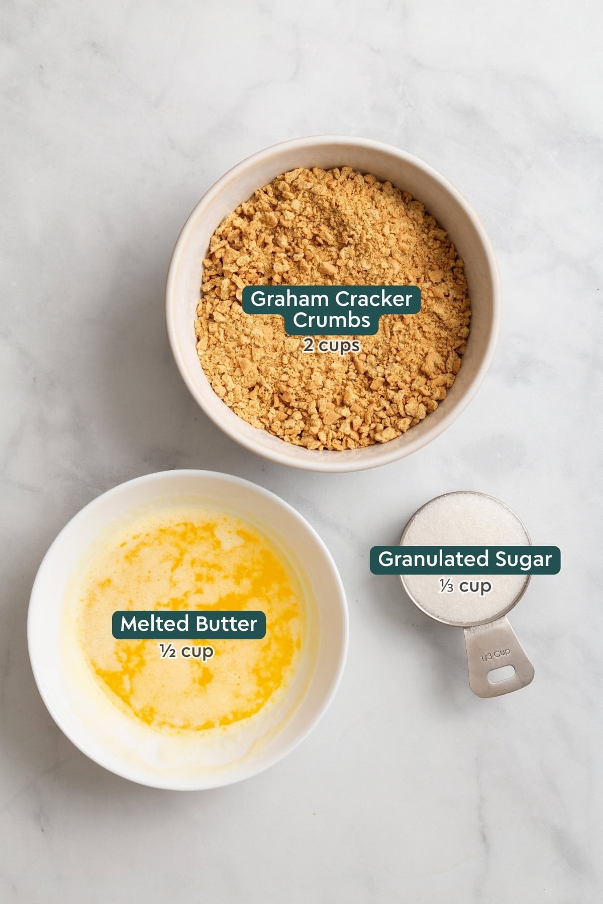 Ingredients for Philadelphia no bake cheesecake crust, including graham crackers, butter, sugar.