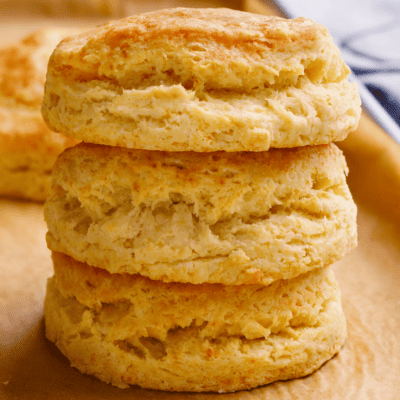Three homemade Popeyes biscuits on top of each other.