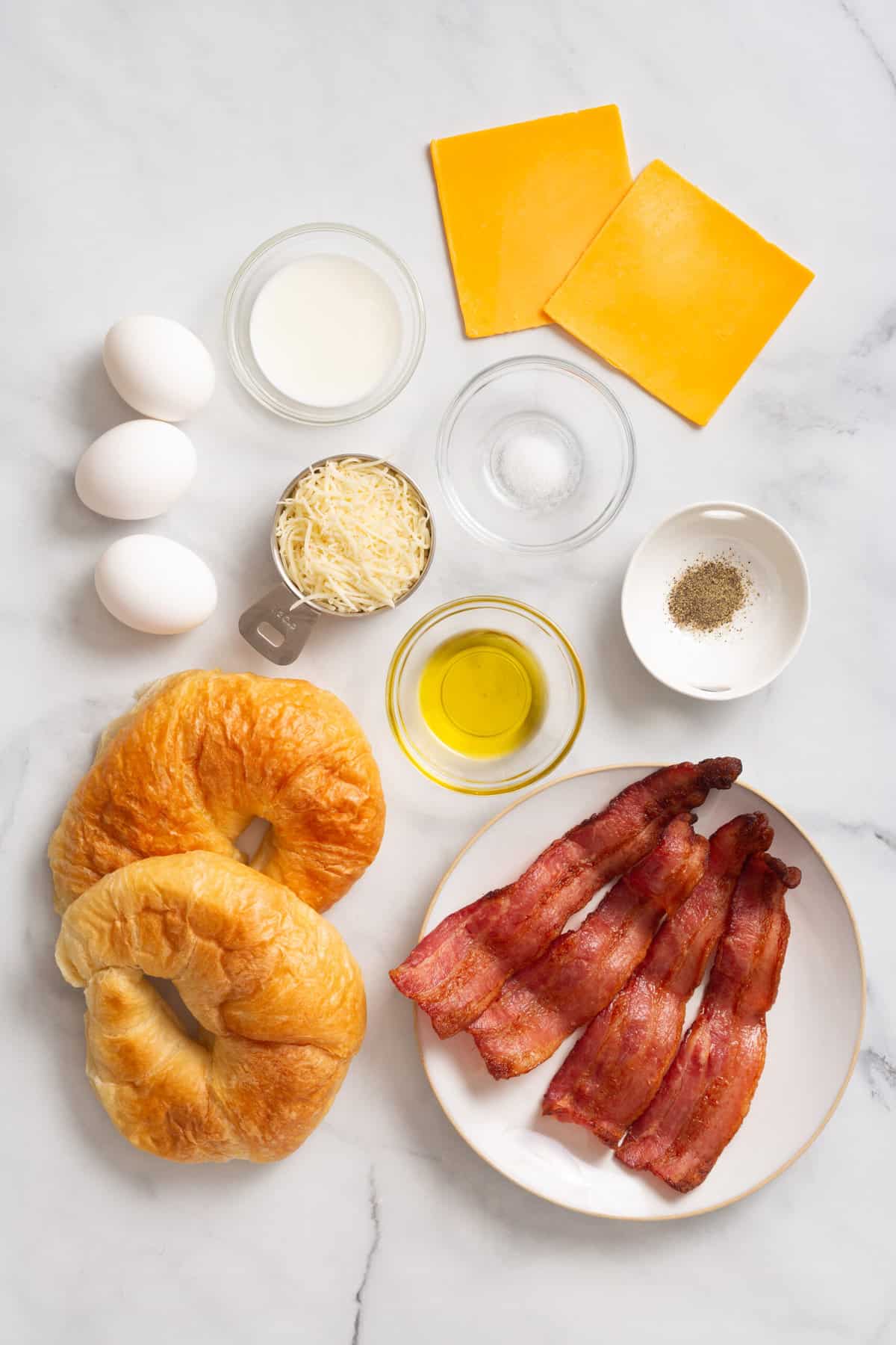Ingredients to make croissant breakfast sandwiches.