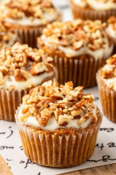 Carrot cake muffins with cream cheese glaze.