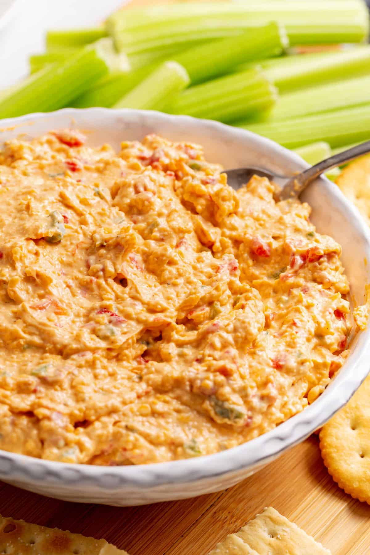 close up image of a bowl of pimento cheese dip.