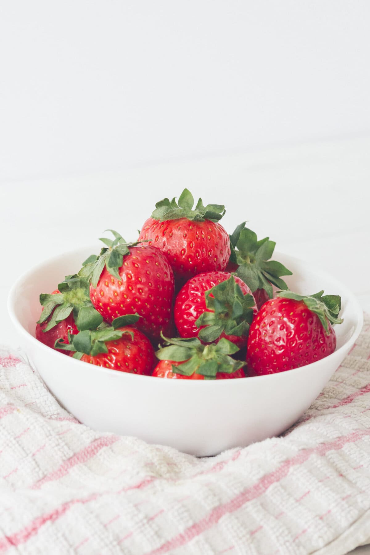a bowl of fresh strawberries.