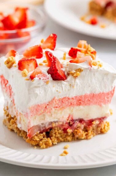 A slice of strawberry delight on a plate.