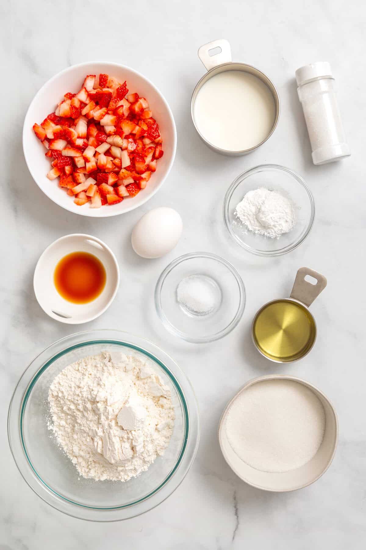 Ingredients to make strawberry muffins.