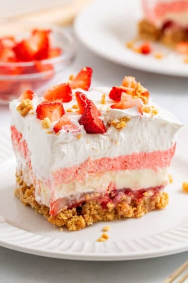 A slice of strawberry delight on a plate.