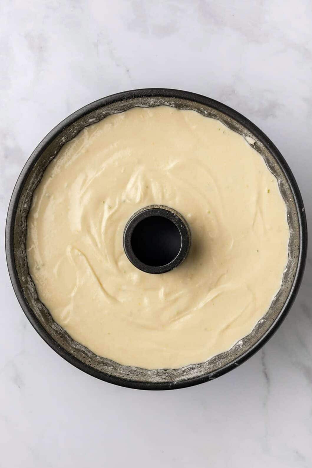 cake batter added to the pound cake bundt pan.