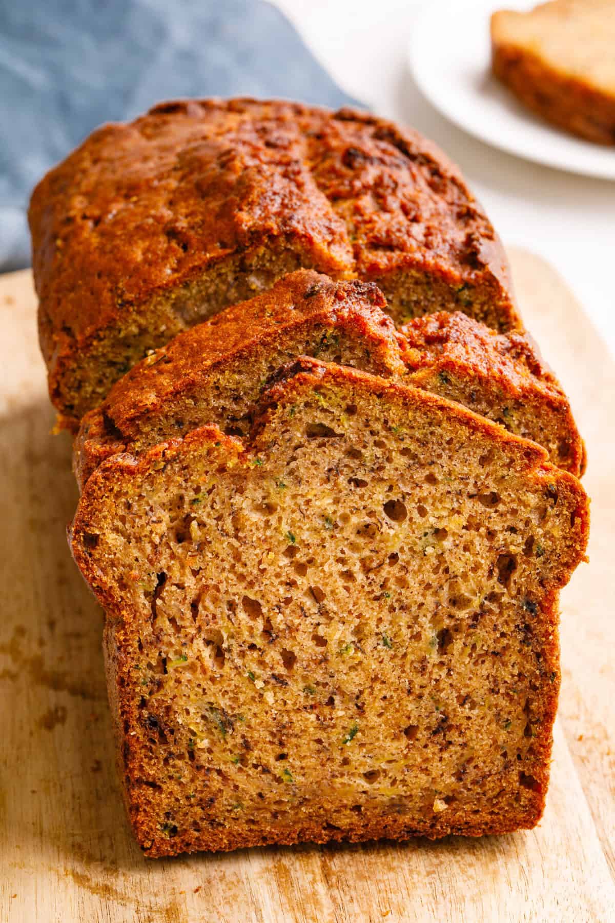 loaf of banana zucchini bread that is sliced and ready to serve. 
