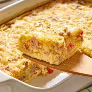 Slice of Bisquick breakfast casserole on a wooden spatula.