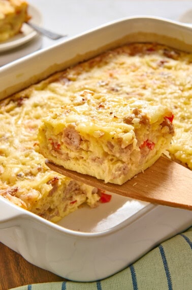 Slice of Bisquick breakfast casserole on a wooden spatula.