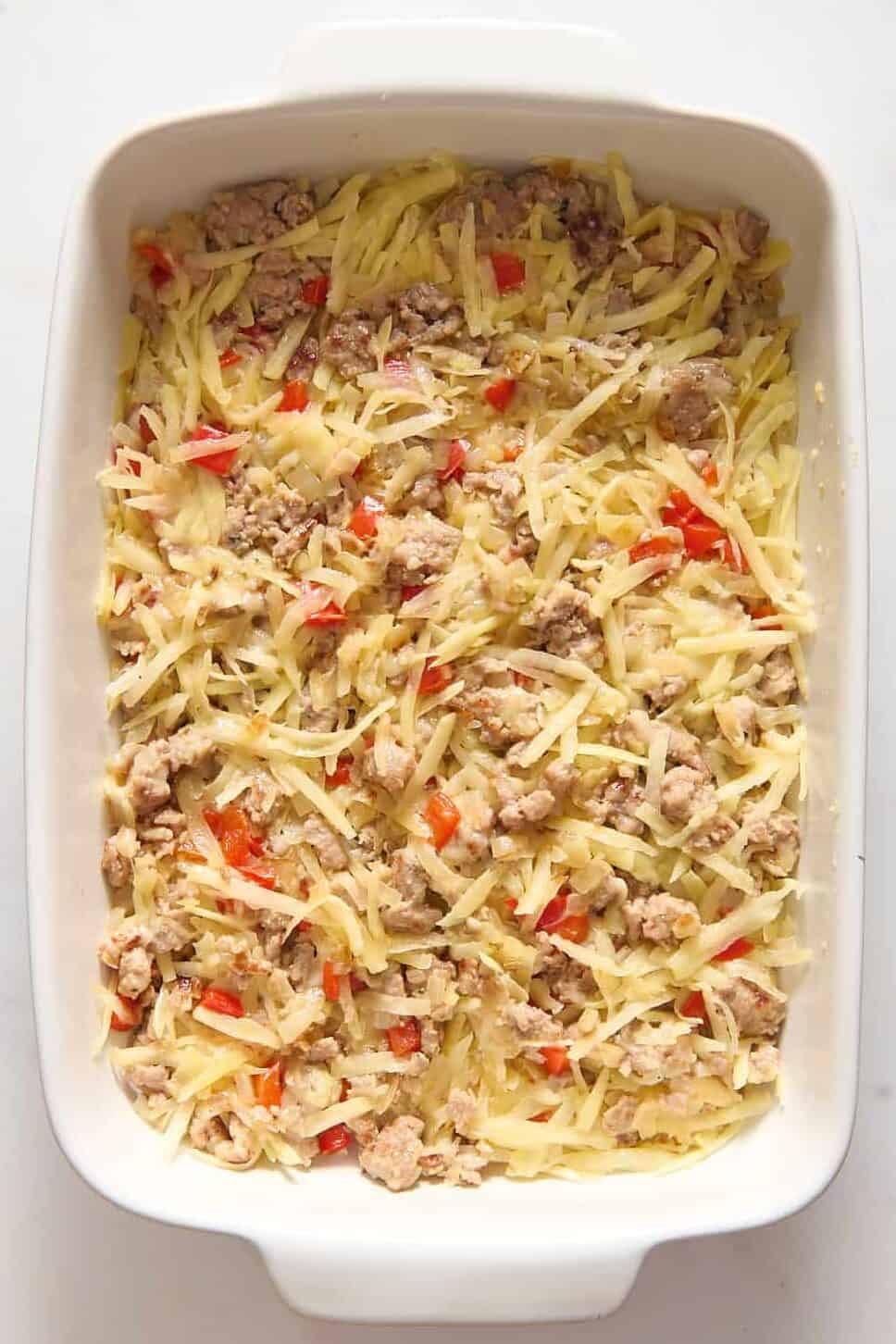 Bisquick breakfast casserole mix in white casserole dish.