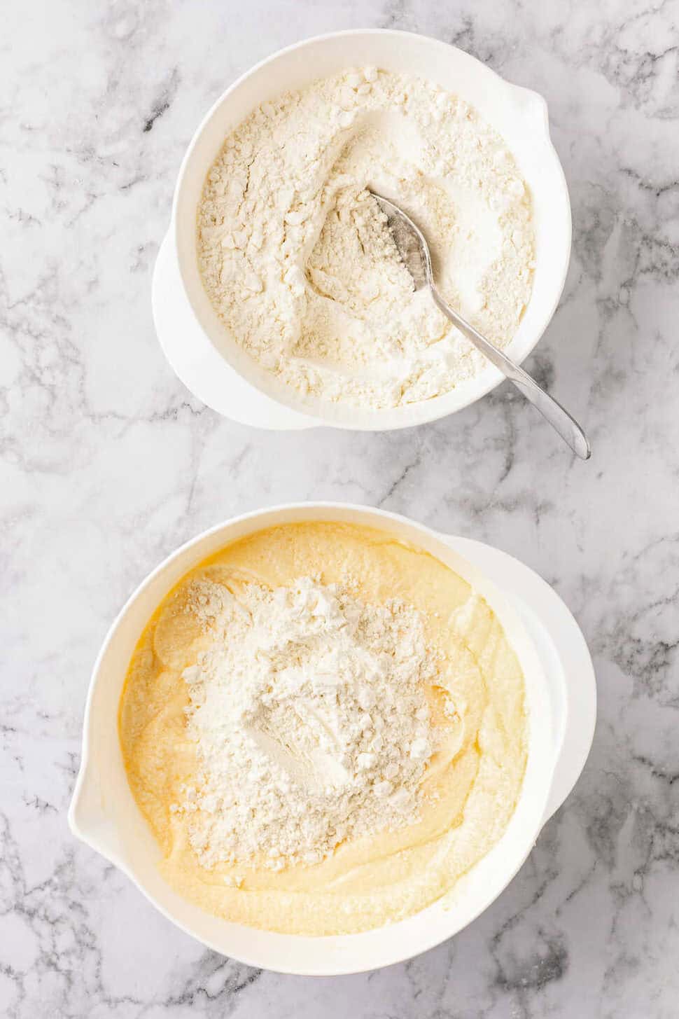 adding flour to the pound cake batter. 