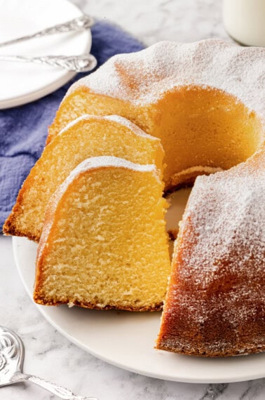 Buttermilk pound cake with two pieces sliced.