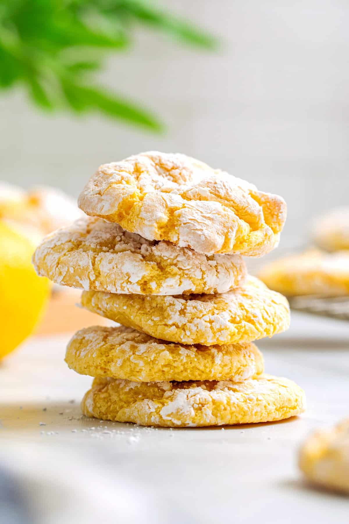 Stack of five Cool Whip cake mix cookies on a kitchen counter.