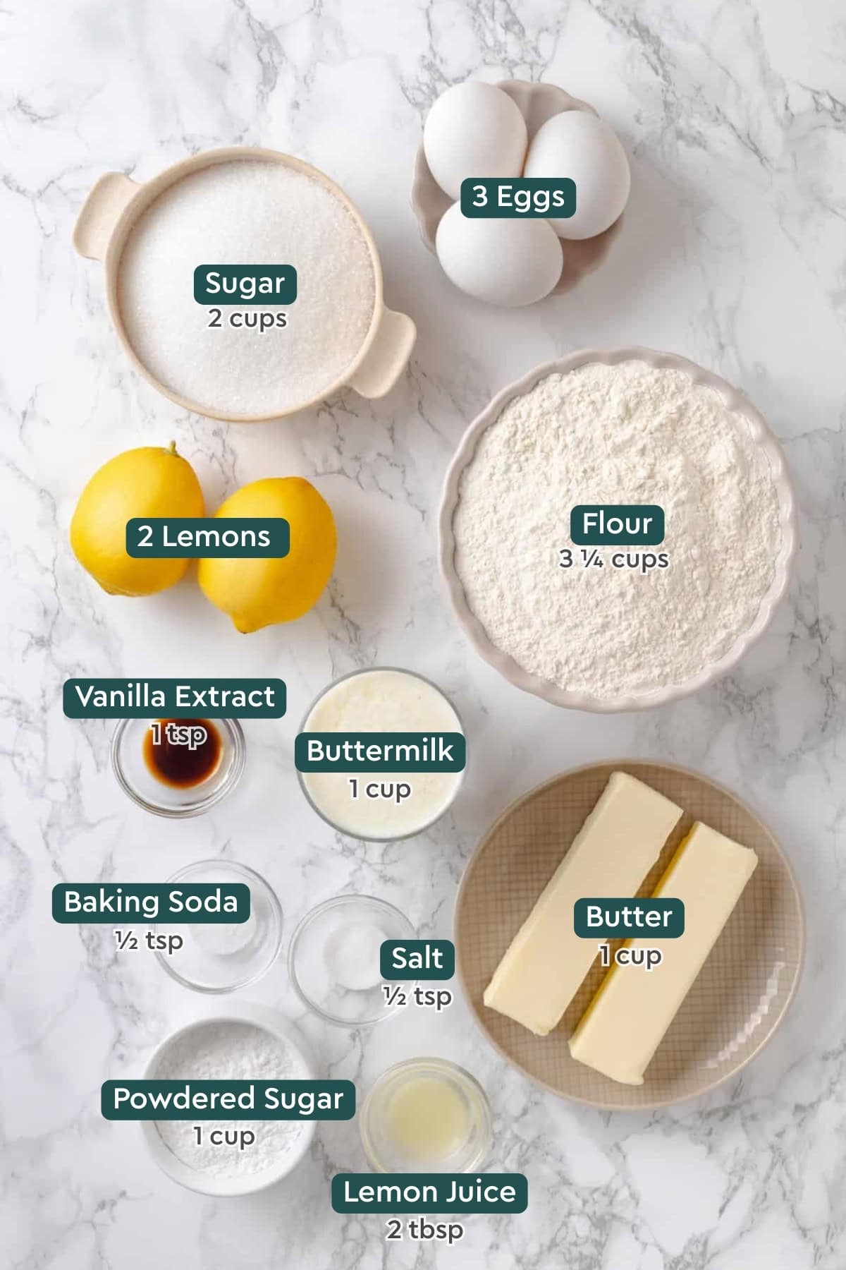 Ingredients for easy lemon pound cake and lemon glaze, including eggs, sugar, flour, lemons, vanilla, buttermilk, eggs, baking soda, salt, powdered sugar.