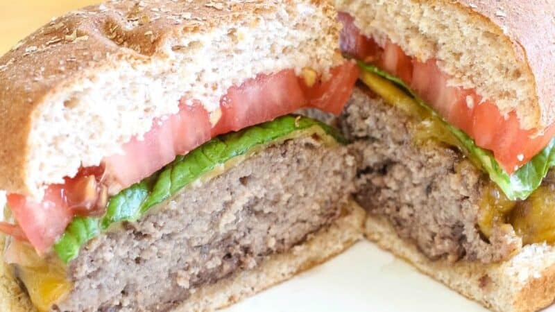 An all-American burger split in half. 