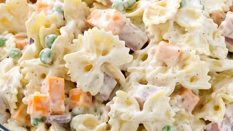 Close up view of bow tie pasta salad. 