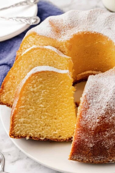 Buttermilk pound cake with two pieces sliced.