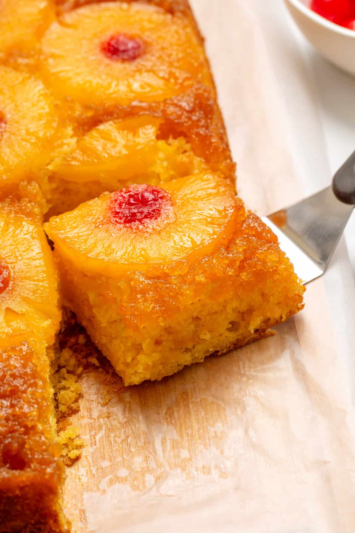 close up picture of one slice of pineapple upside down cake