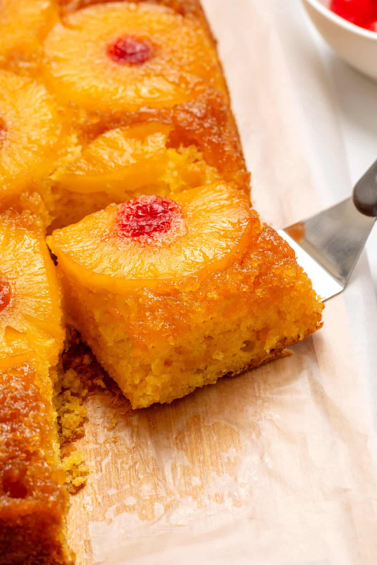 close up picture of one slice of pineapple upside down cake. 