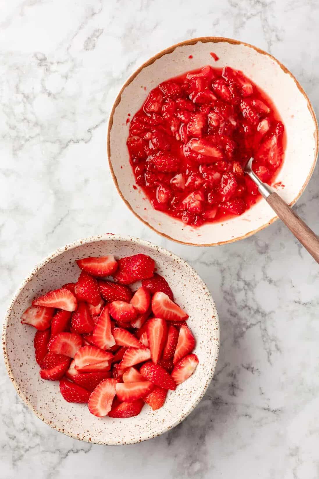 Fresh strawberries two bowls of fresh strawberries.