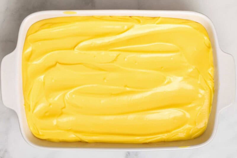 Pudding spread over poke cake.