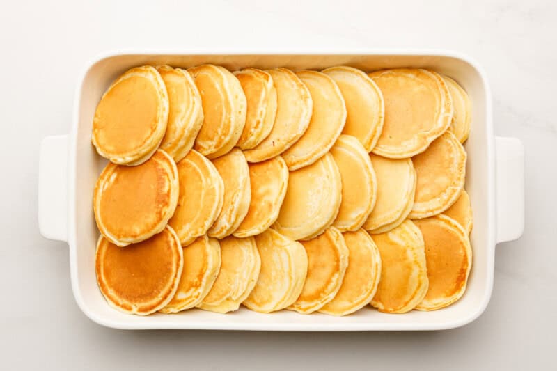 pancakes overlapping in a casserole dish