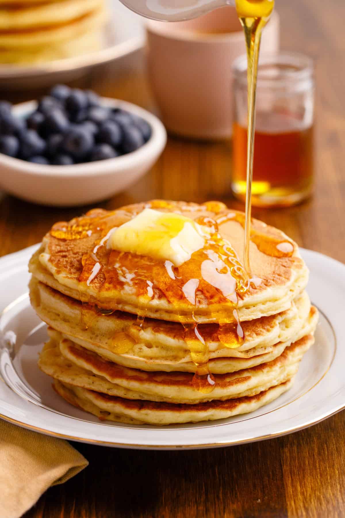 Homemade Cracker Barrel pancakes with maple syrup.