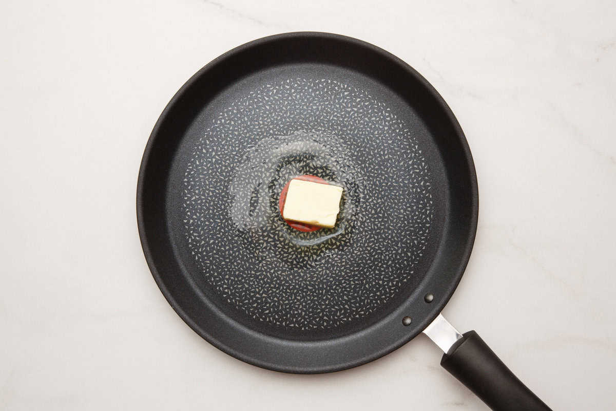 Large skillet with melting butter.