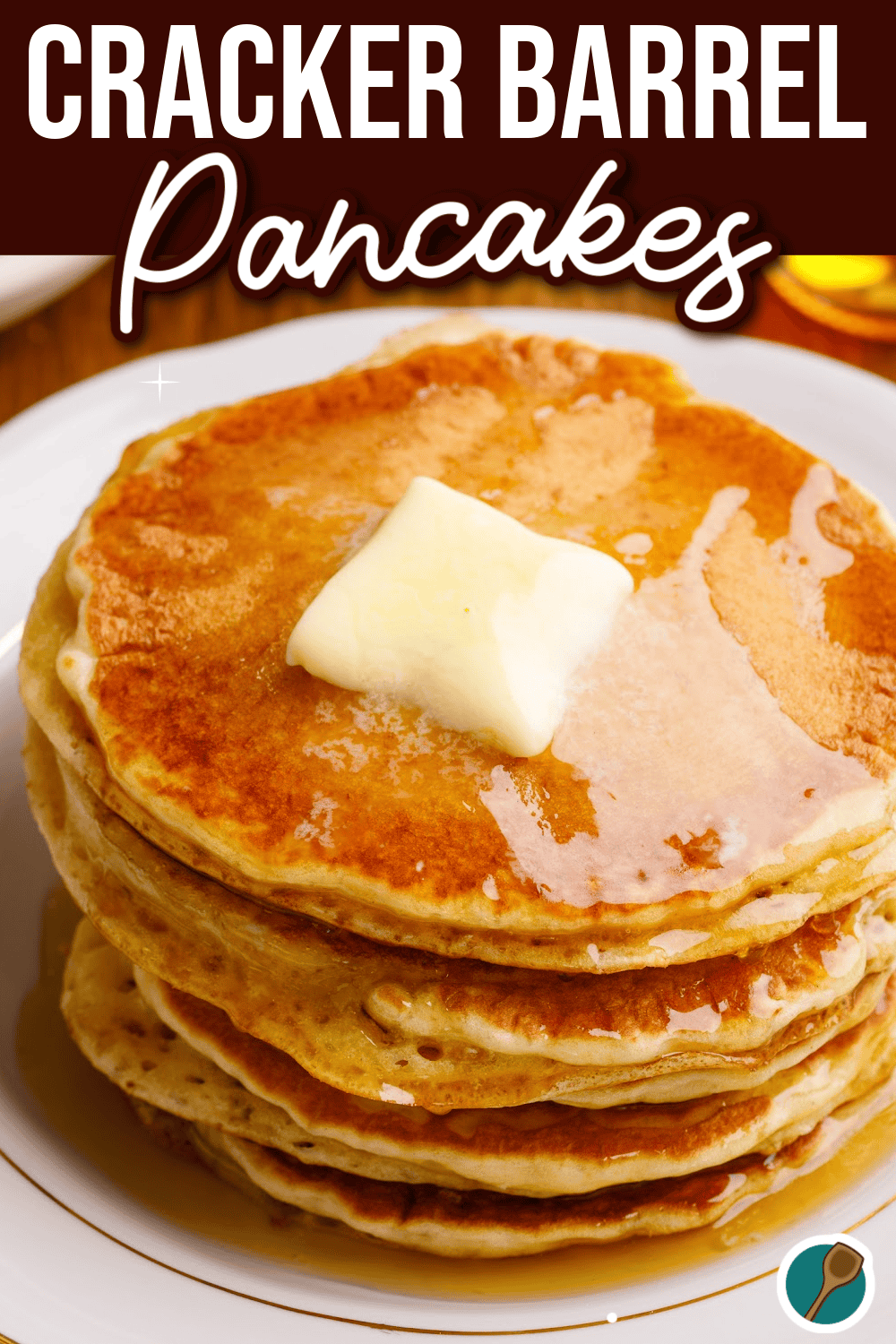 A stack of golden, fluffy pancakes topped with a melting pat of butter, inspired by Cracker Barrel’s iconic breakfast. The pancakes are perfectly cooked with a light and airy texture, capturing the homestyle look and taste of the classic restaurant favorite. An inviting dish that’s perfect for a comforting breakfast at home.