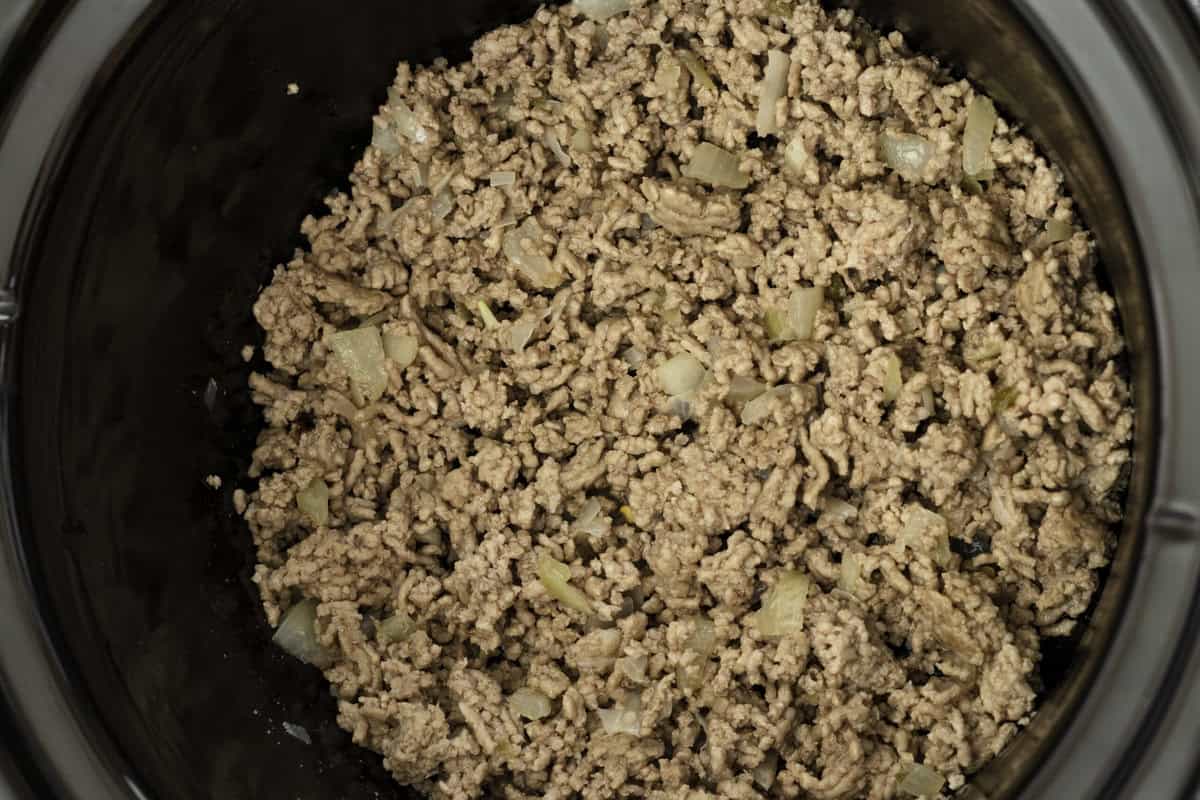Ground beef in a skillet.