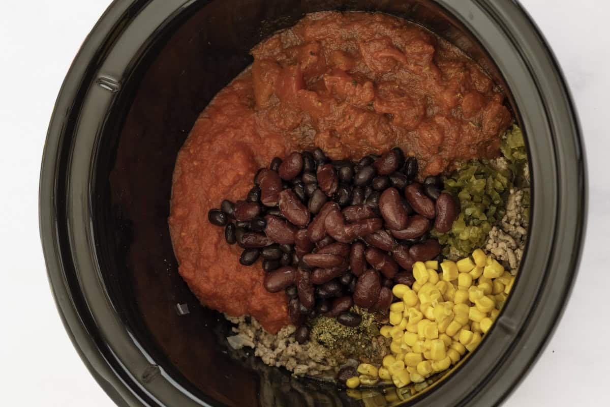 Taco soup ingredients in a crockpot.
