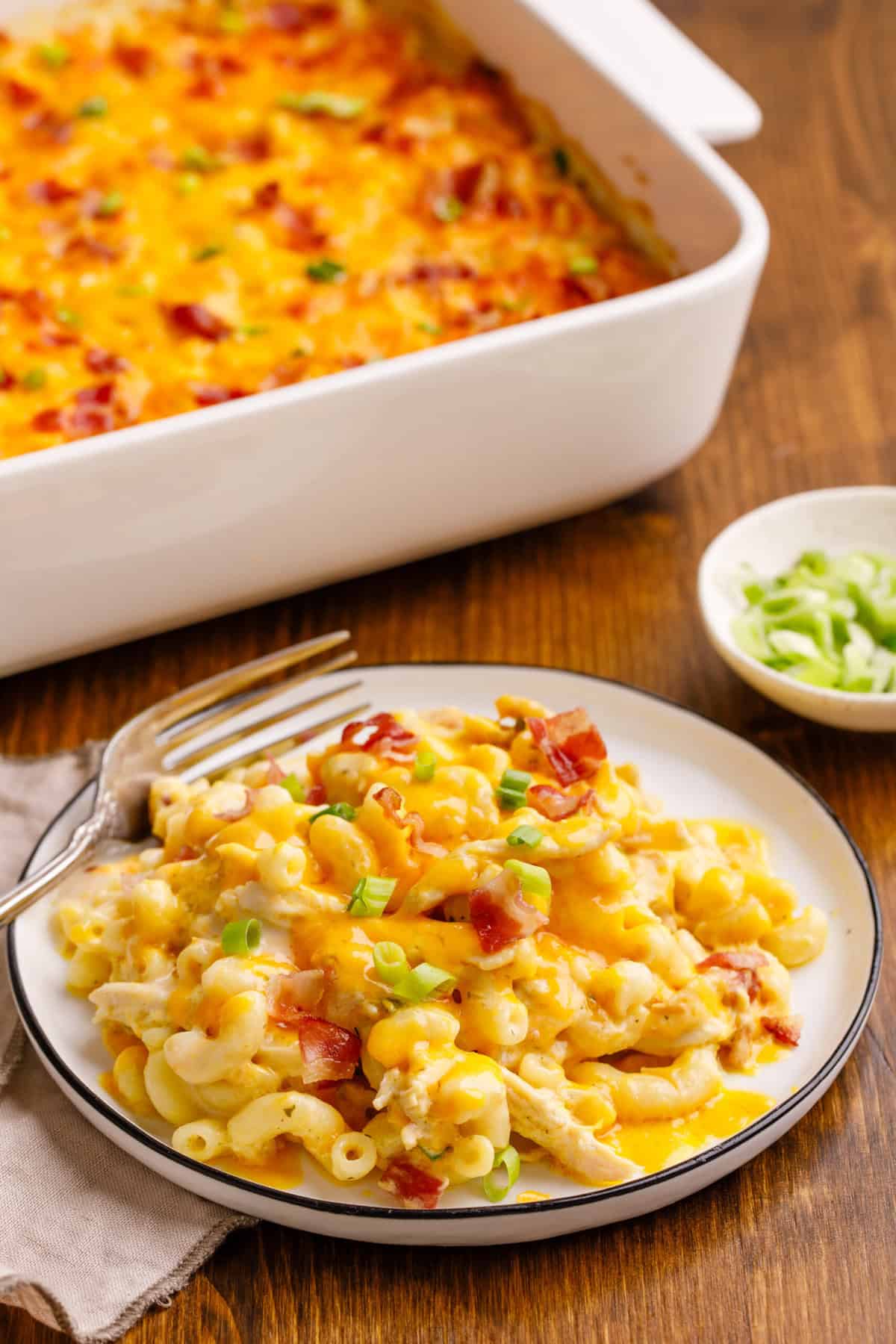Crack chicken casserole on a plate with the casserole dish in the background. 