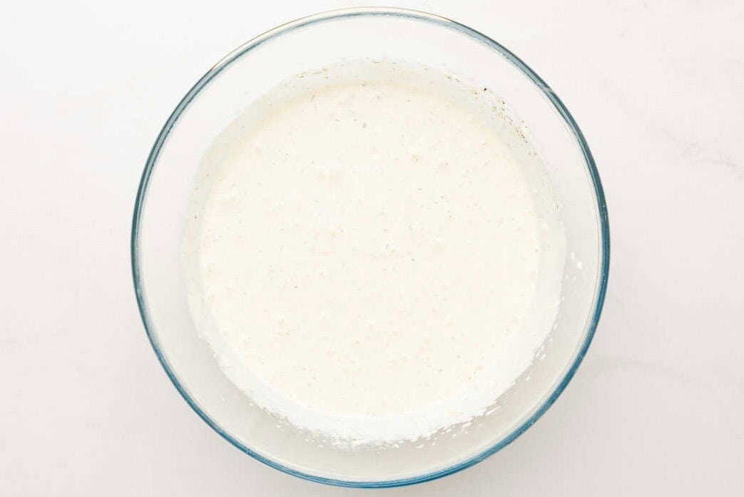Milk in a large glass bowl. 