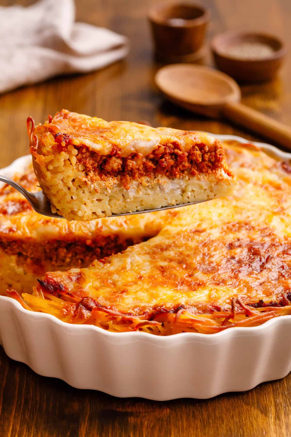 slice of spaghetti pie on a spatula.
