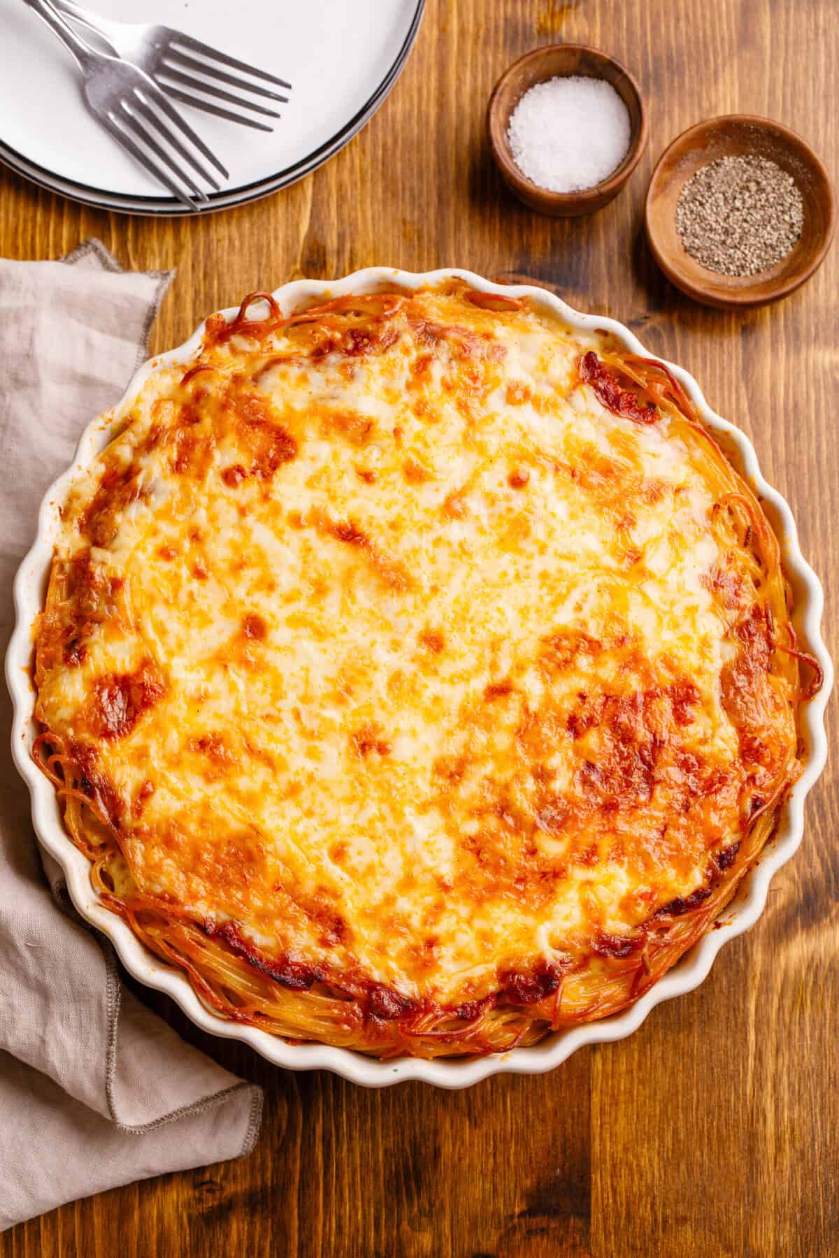 whole spaghetti pie on a table.