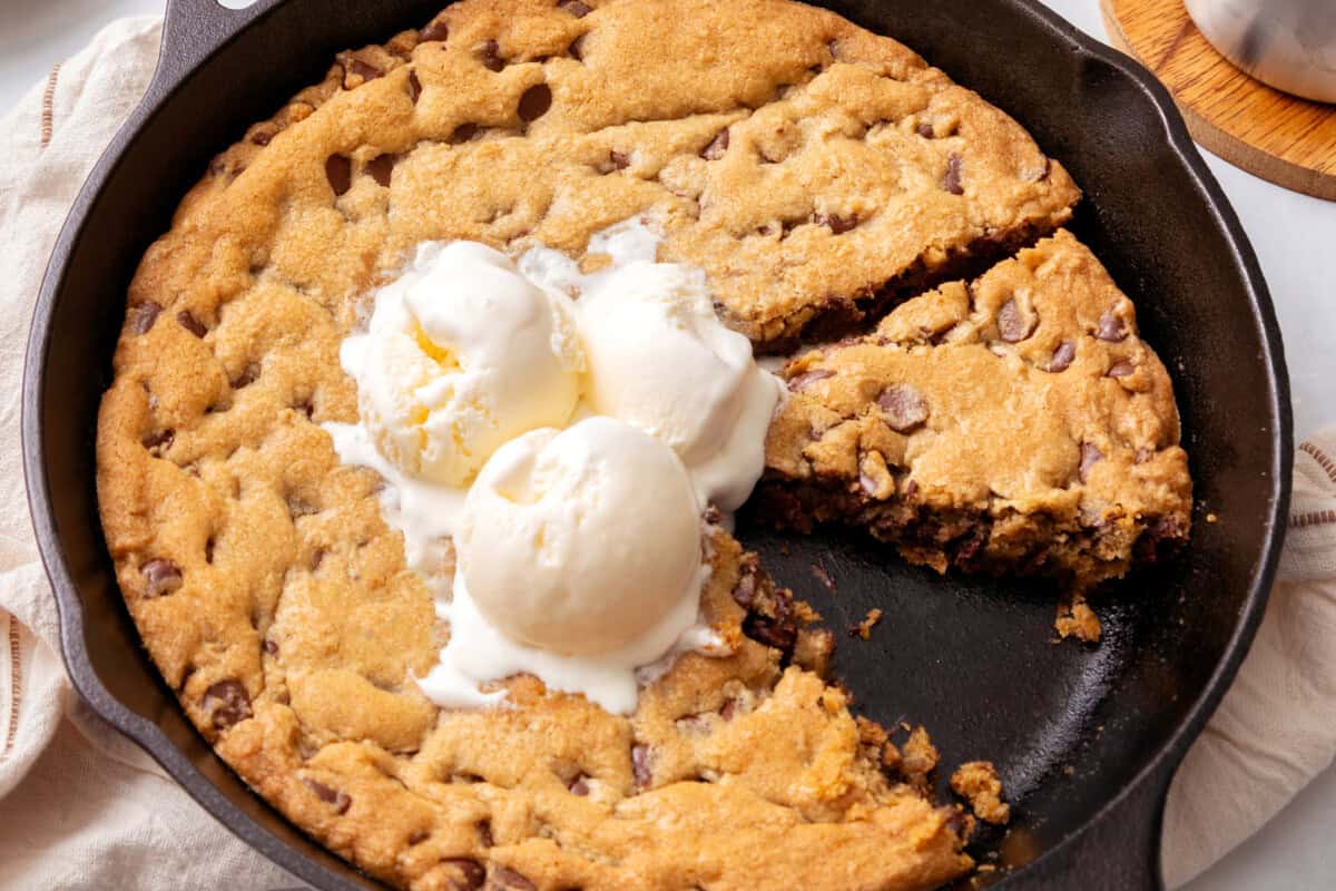 Large chocolate chip cookie made in a skillet.