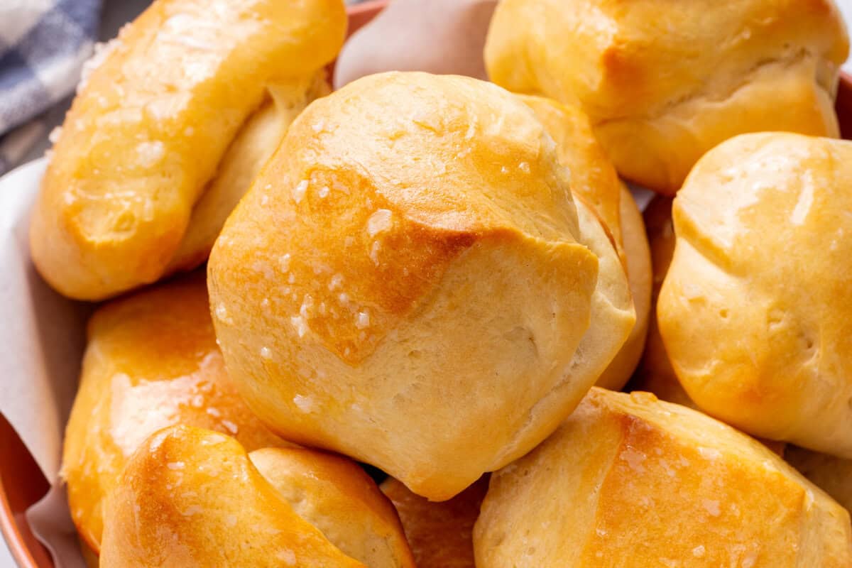 close up of buttered parker house rolls. 