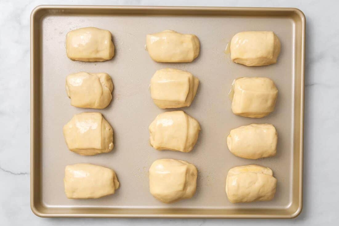 placing the rolls on the baking sheet. 