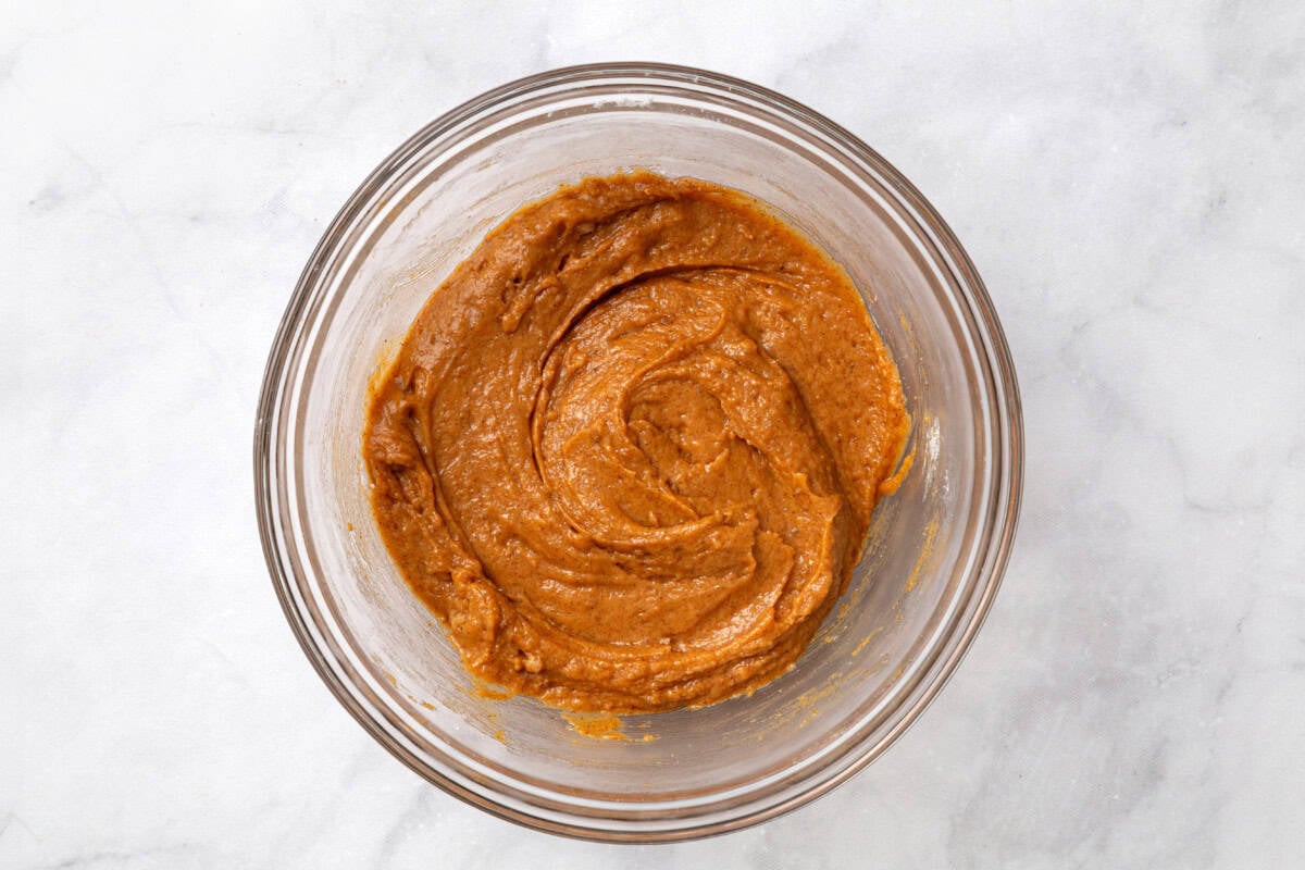 Pumpkin coffee cake batter in bowl.
