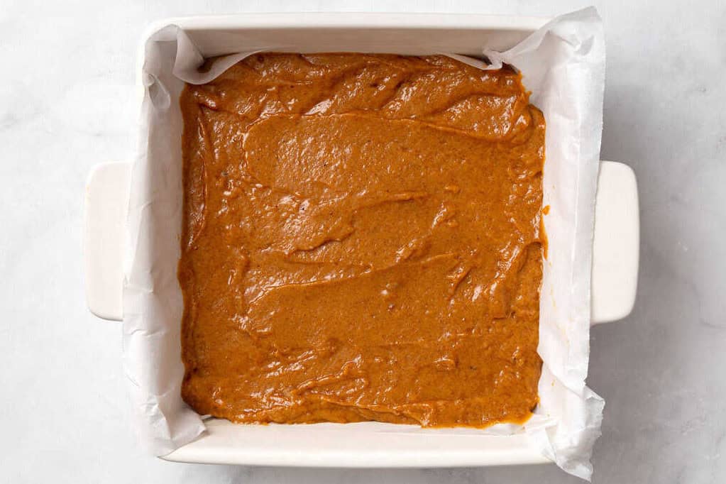 pumpkin coffee cake batter in cake pan.