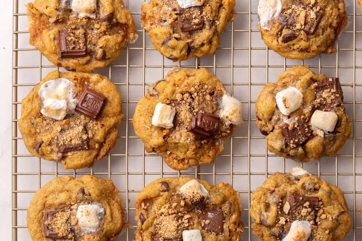 pumpkin s'mores cookie Pumpkin s'mores cookies on a wire rack.