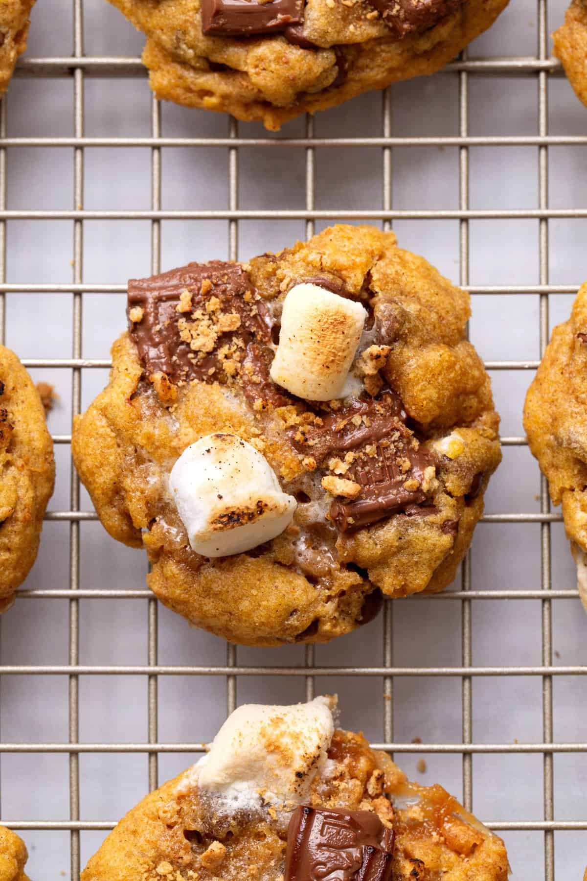 pumpkin s'more cookies Pumpkin s'mores cookies on a wire rack.