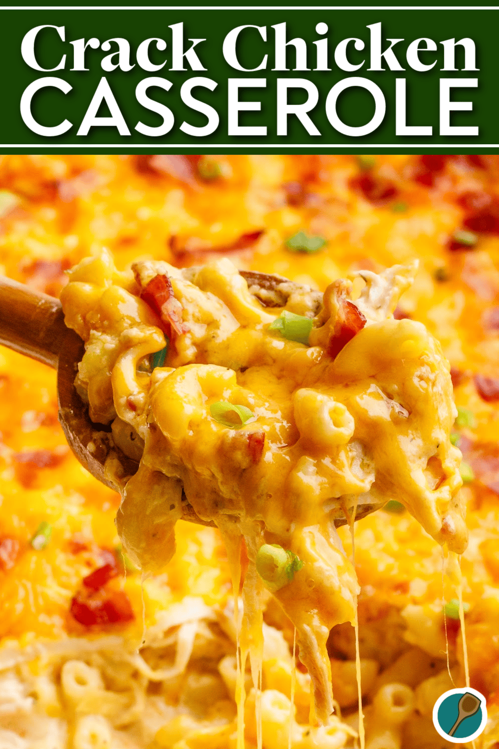 Close-up of a spoonful of creamy Crack Chicken Casserole with shredded chicken, melted cheddar cheese, bacon, and green onions. This comforting casserole is an easy weeknight dinner recipe loaded with cheesy goodness and packed with flavor.