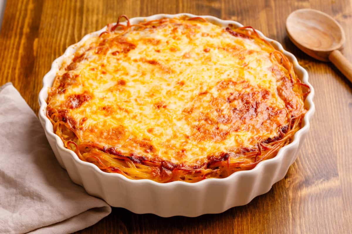Spaghetti pie in deep dish pan.