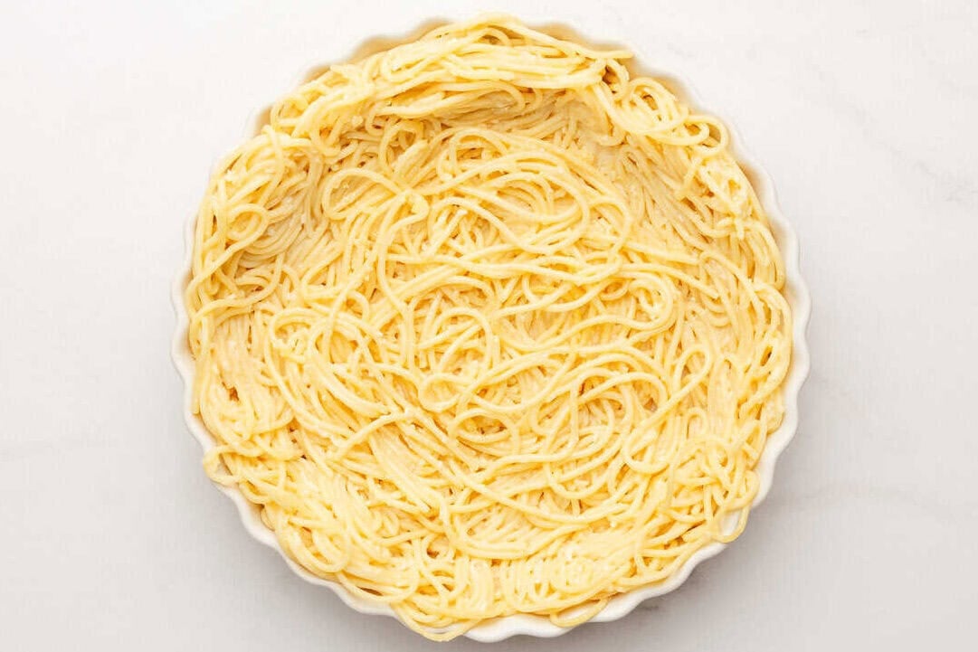 spaghetti pie crust in a pan.