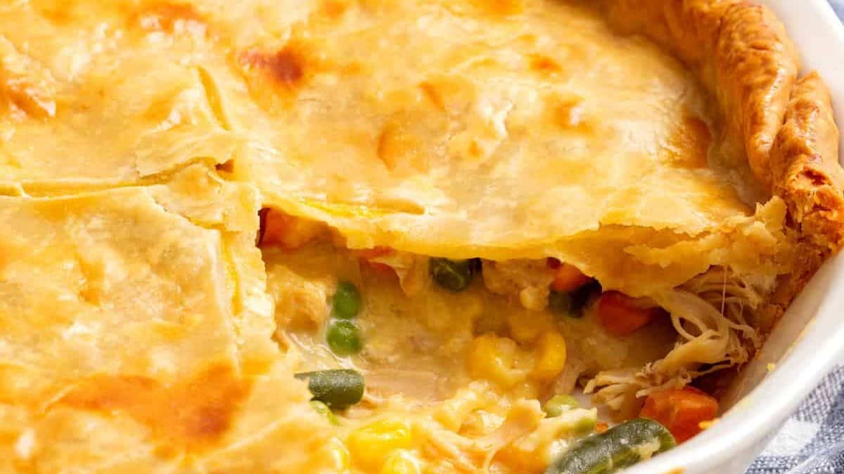 Campbell's chicken pot pie with a slice missing.