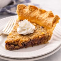slice of kentucky derby pie with whipped cream.