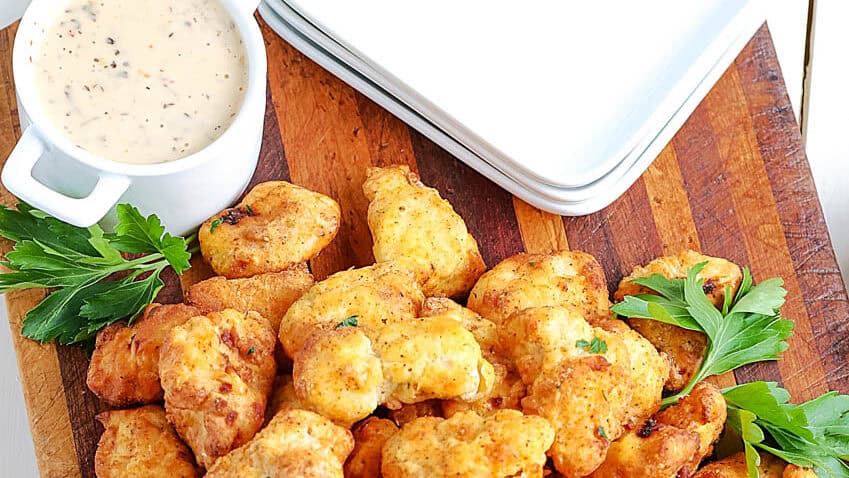 air fryer popcorn chicken on a cutting board